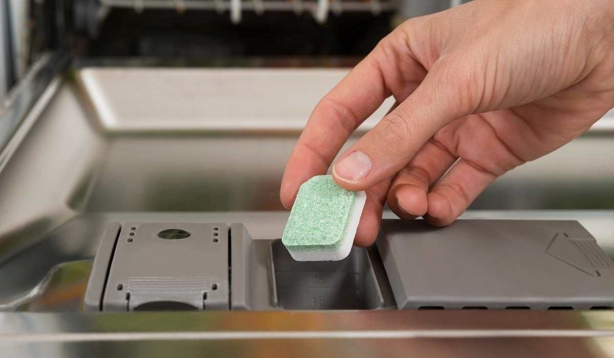 Put dishwashing soap in dishwasher machine by instructions