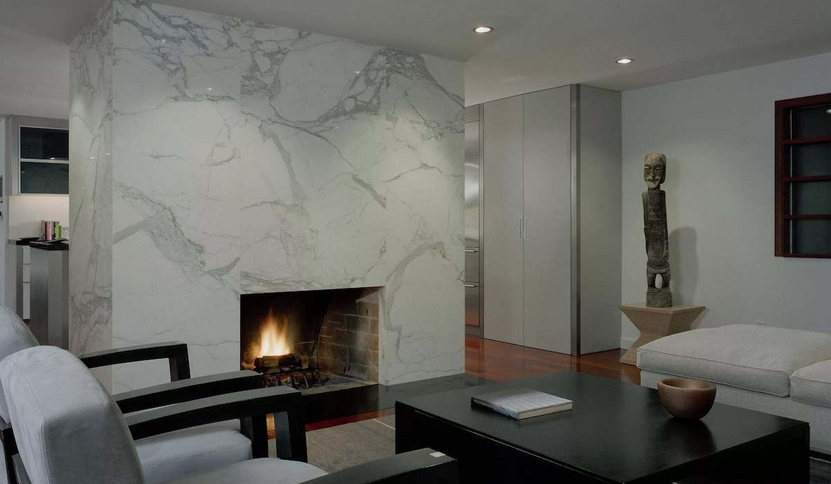 white marble tile fireplace heart and around design