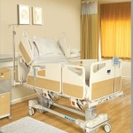 Midmark Janak Hospital Bed; Full Semi Electric Side Rail Feature Supportive Surface