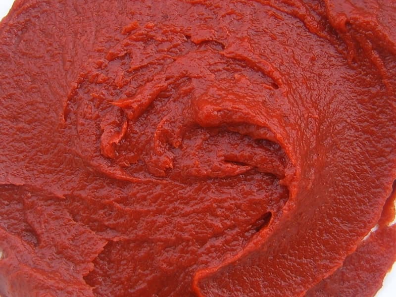 Potassium of 580g canned tomato paste in tin