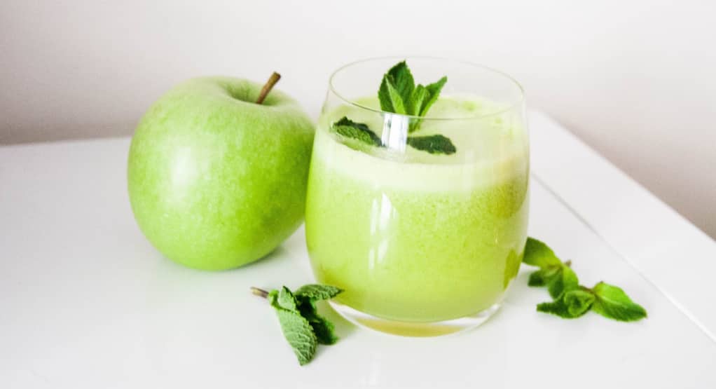 Glass Of Fresh Organic Apple Juice With Green Apples In Box On