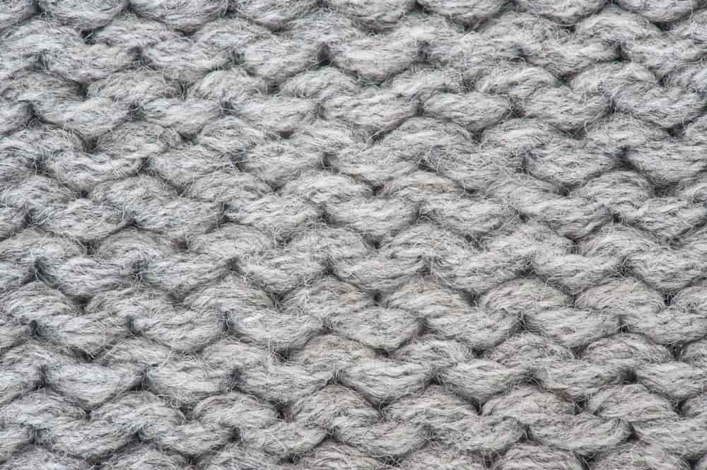 is tricot fabric knit or woven