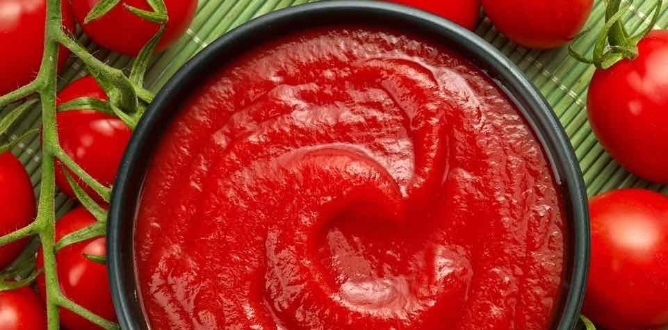 How is tomato paste made in a factory