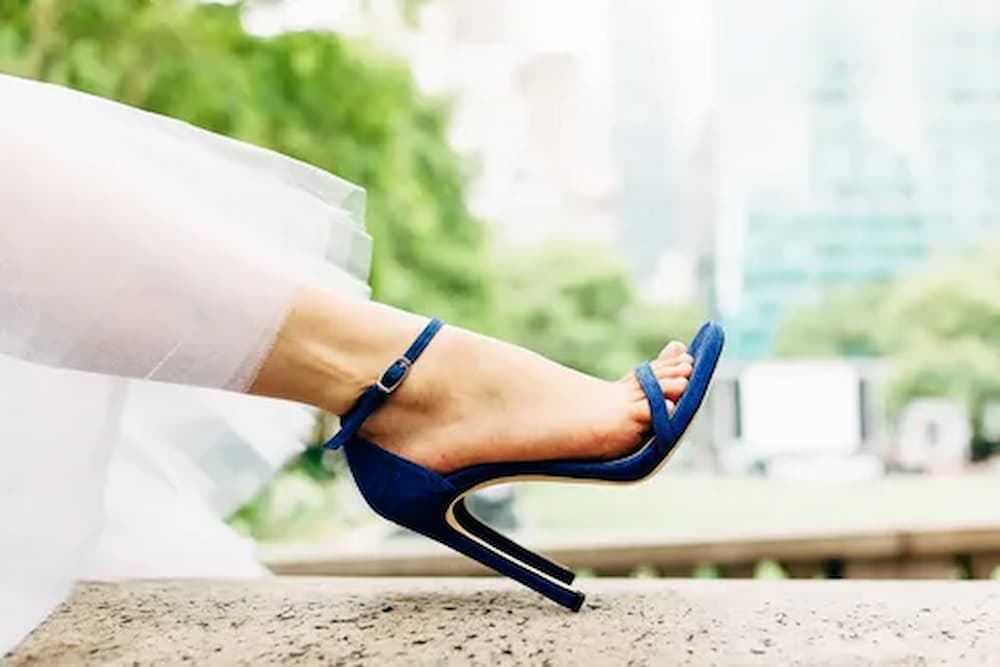 Shoe shopping woman trying on high heels shoes at home online buying  fashion footwear stylish suede stilettos clothing panoramic banner header  crop of women s feet Stock Photo by ©Maridav 514022650