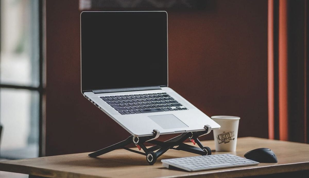 ergonomic desk with laptop