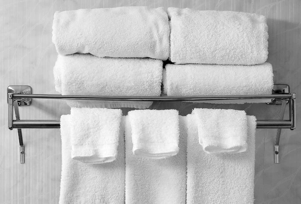 2 towel bars on wall