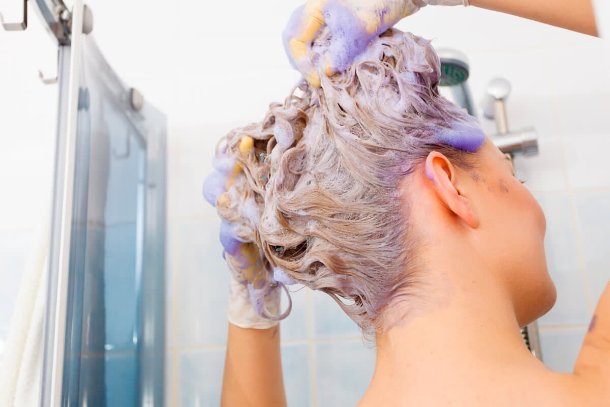 Use the shampoo that comes in the bottle with the purple cap.