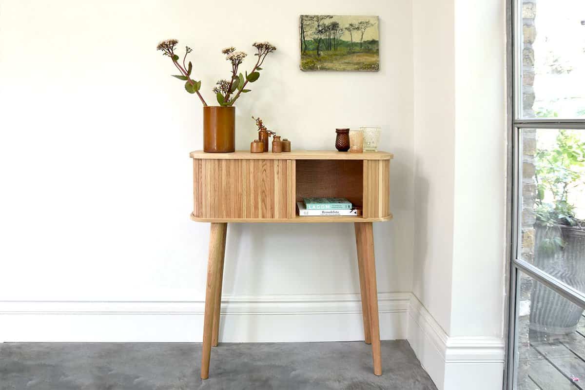 Wooden console table with shoe storage